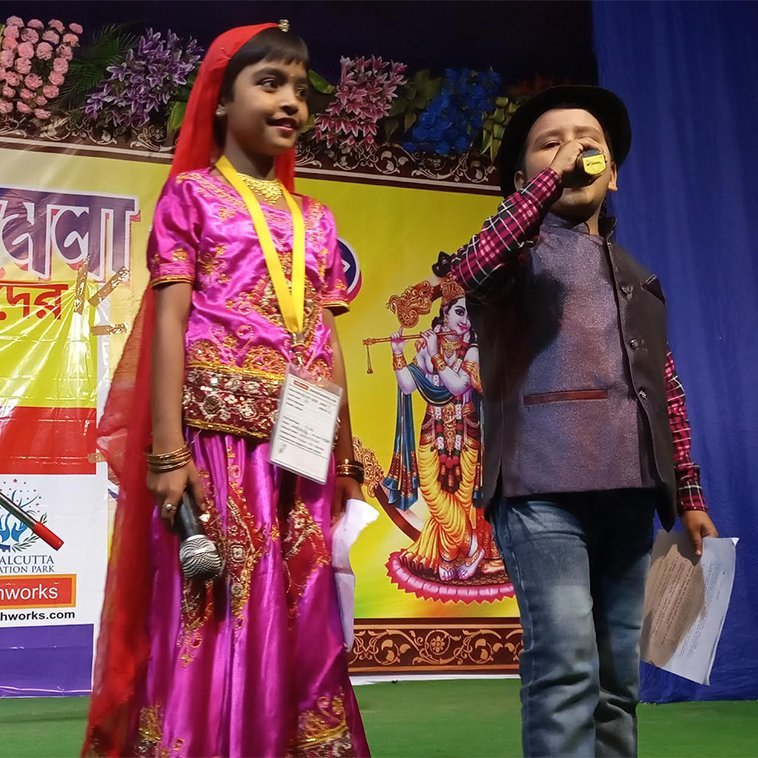 Students Anchoring in a Village Event